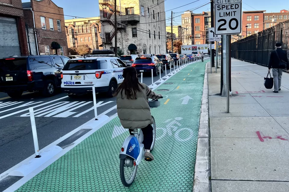 Green bike lane with flexible delineators and textures paint in Hoboken, New Jersey